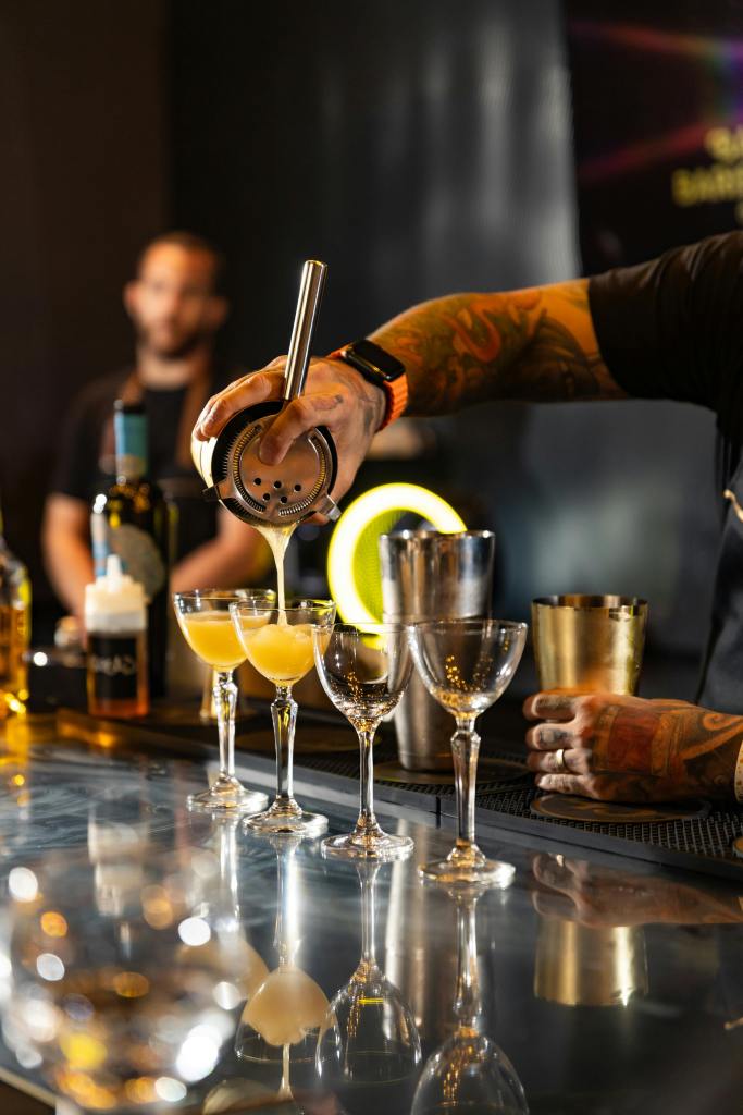 Photo by Rick Sousa: https://www.pexels.com/photo/bartender-pouring-cocktail-in-stylish-bar-setting-30357631/